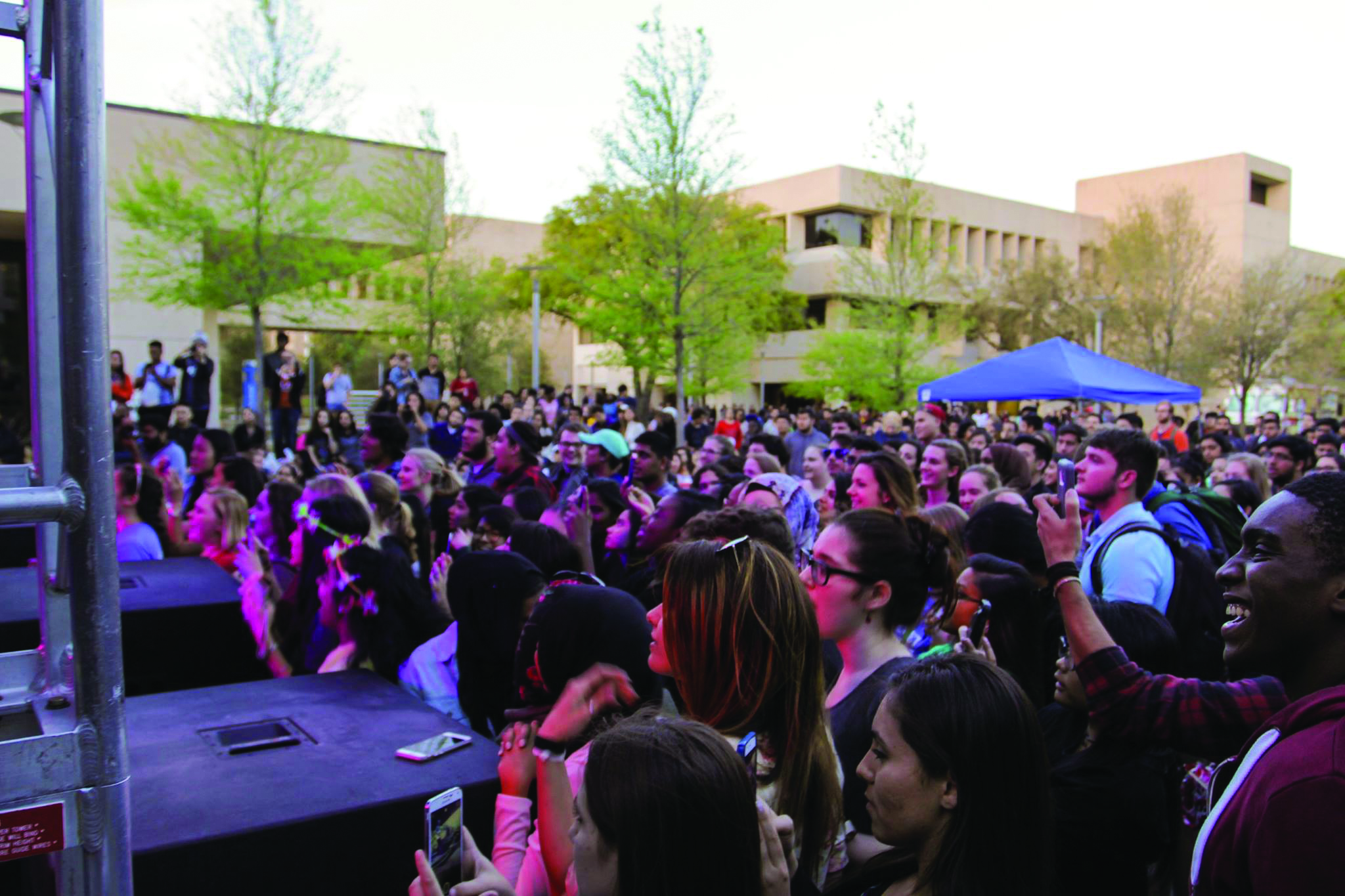 A crowd watches Alex and Sierra perform