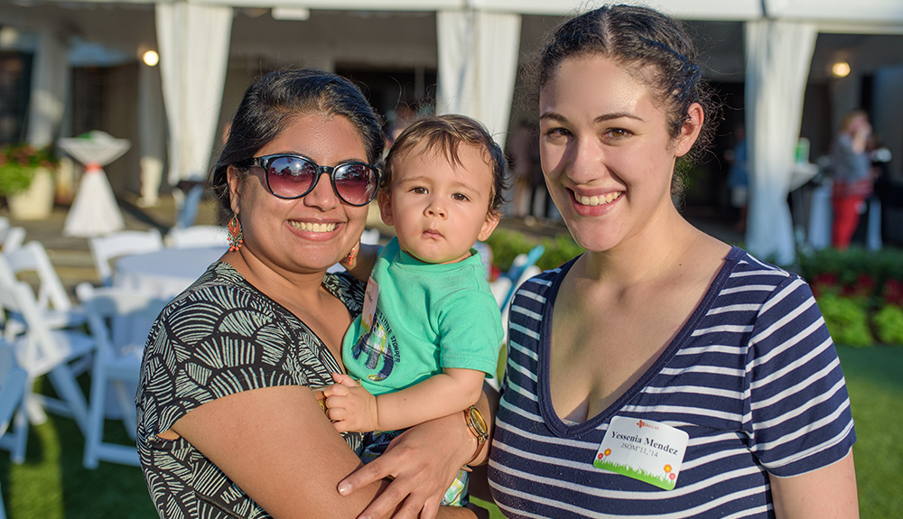 Yessenia Mendez BS’11, MBA’14 (right) and her son chat with Rekha Manohar BS’11, MS’14, MBA’14.