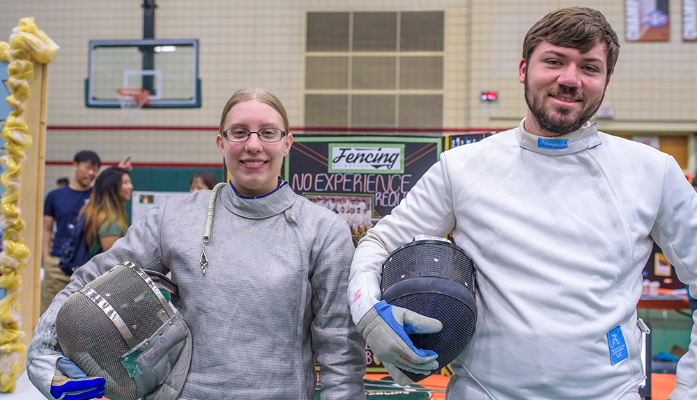 Emily Risinger and Conner Gray suited up to represent the Fencing Club at the student organization fair.