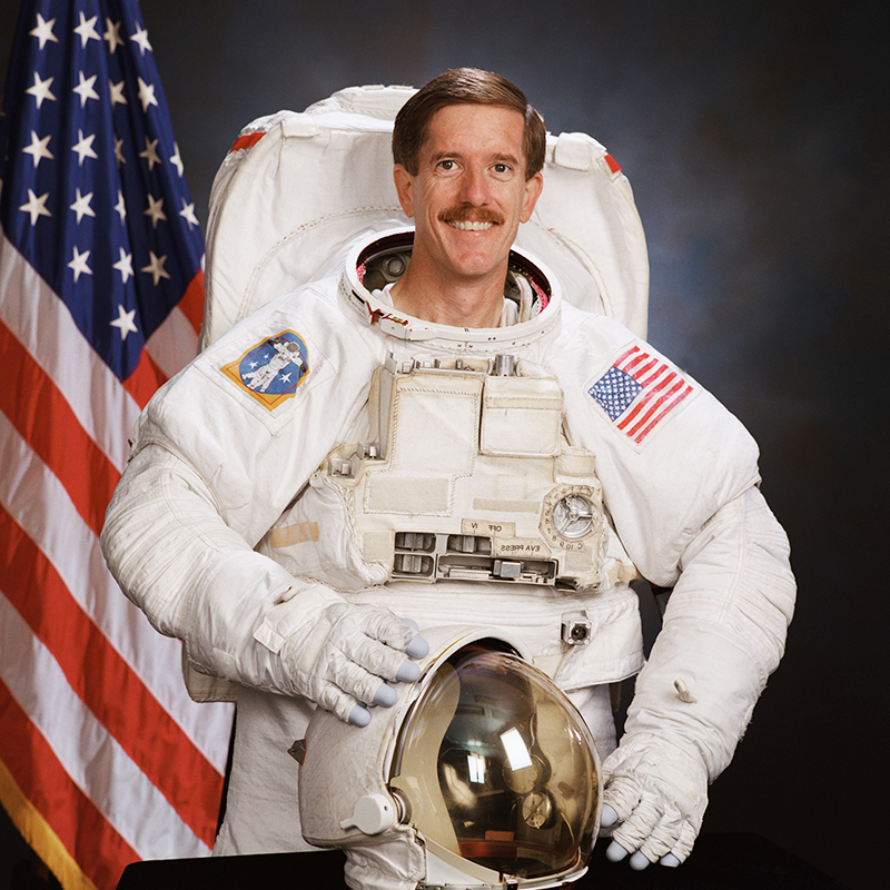 Reilly wears a spacesuit in a NASA photo