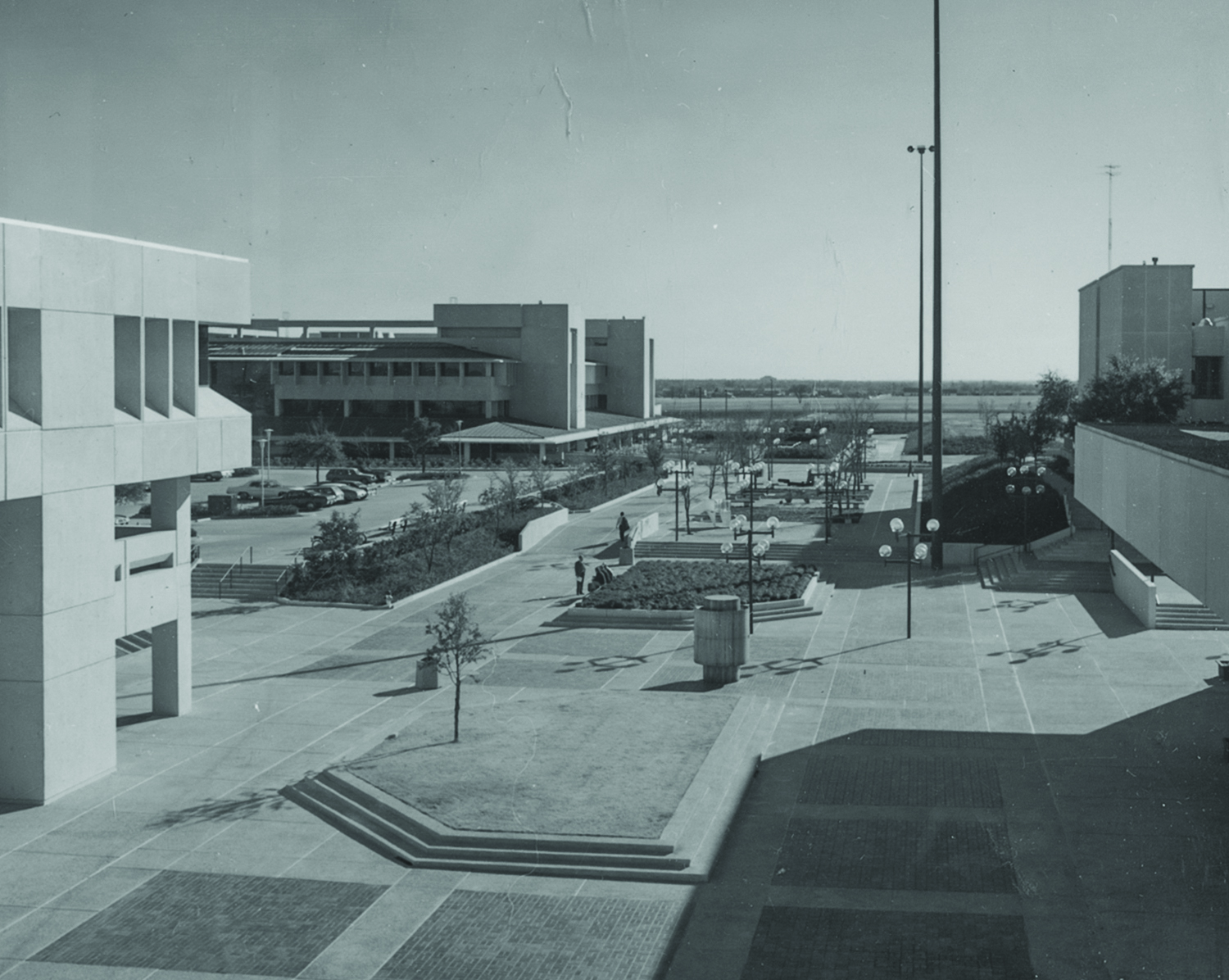 Black and white photo of the old, concrete campus mall