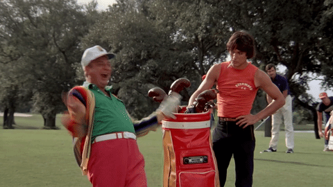 Rodney Dangerfield celebrating on a golf course