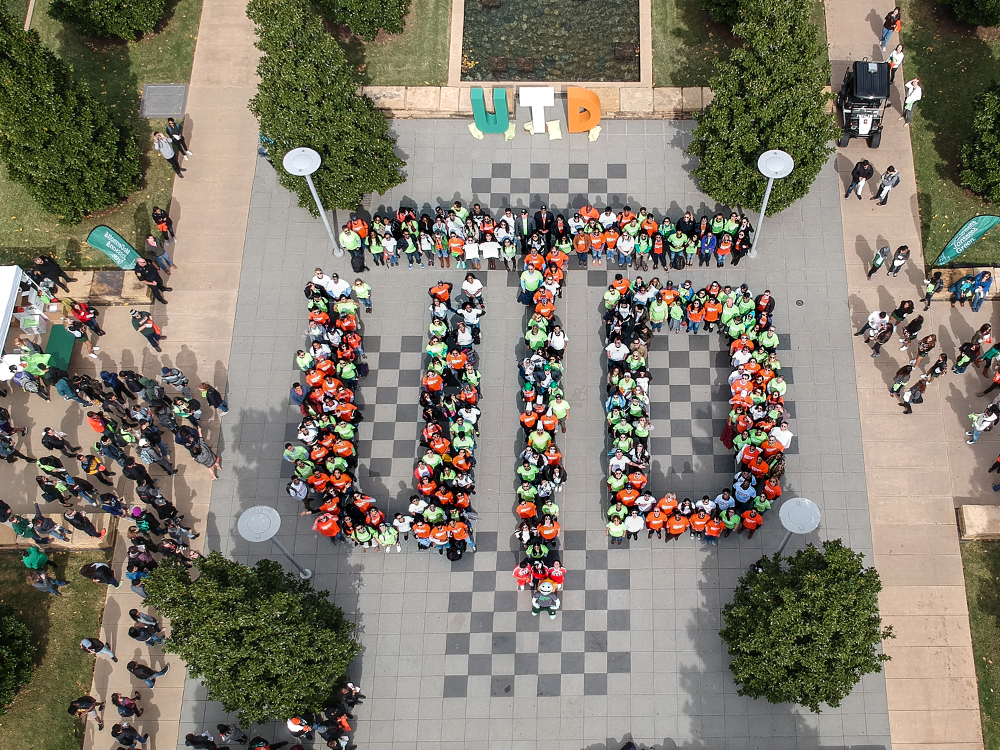 Drone photo of people spelling UTD at chess plaza