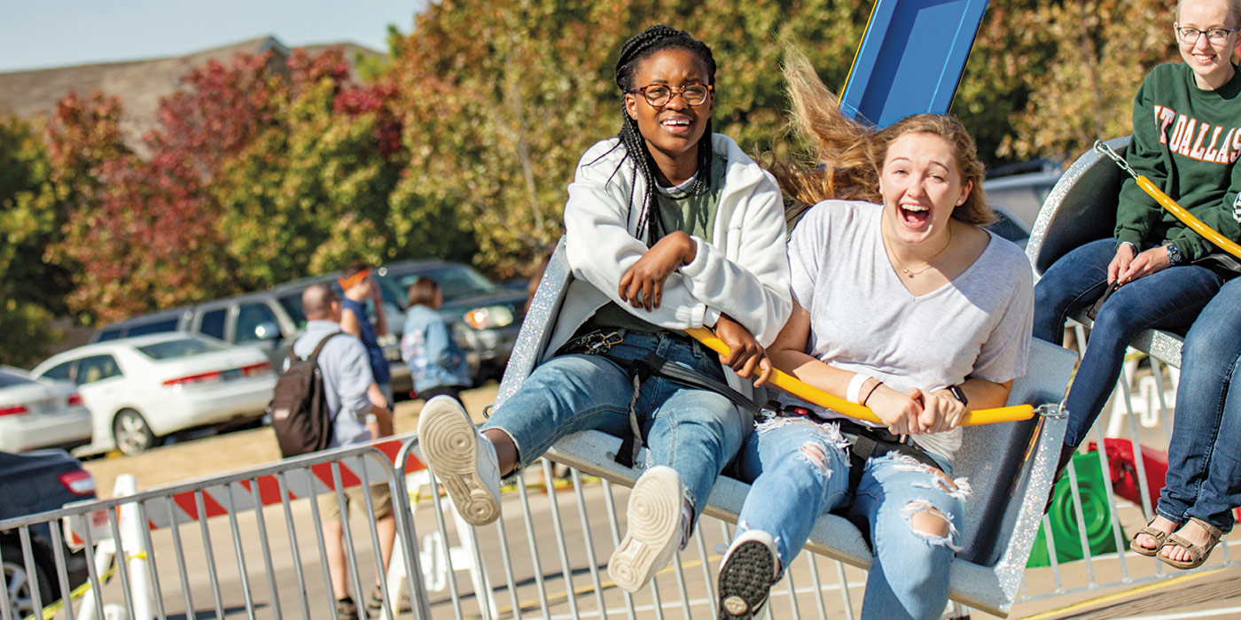 students riding the carnival at Homefest