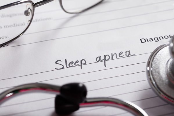docotor's notepad with words sleep apnea written on it