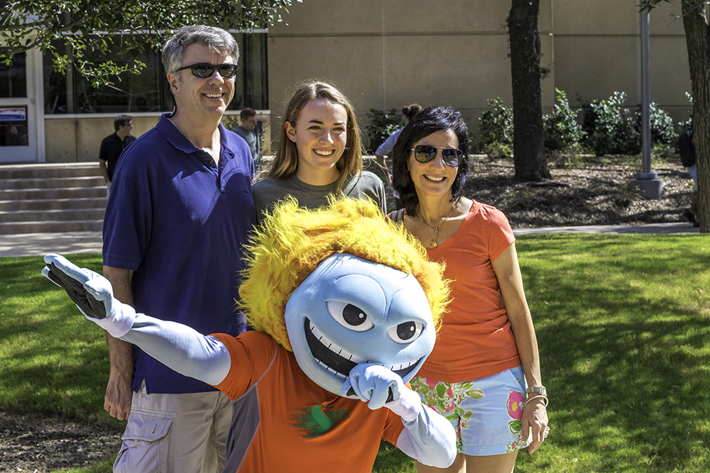 Michelle Edgar and her parents, Mark and Juliette, posed for a photo with Temoc.