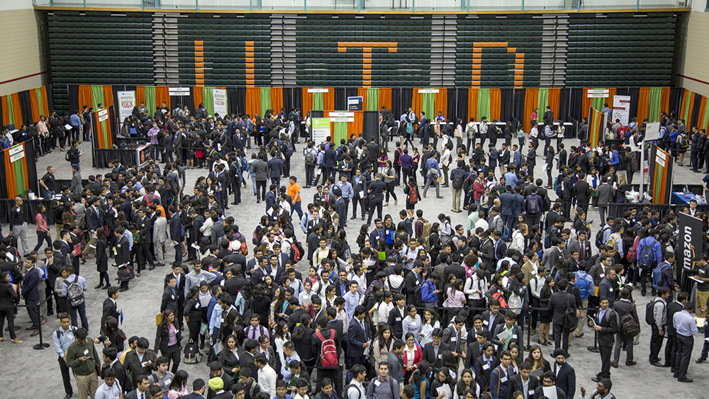 a bird's eye view of students and alumni in the Activity Center for the expo