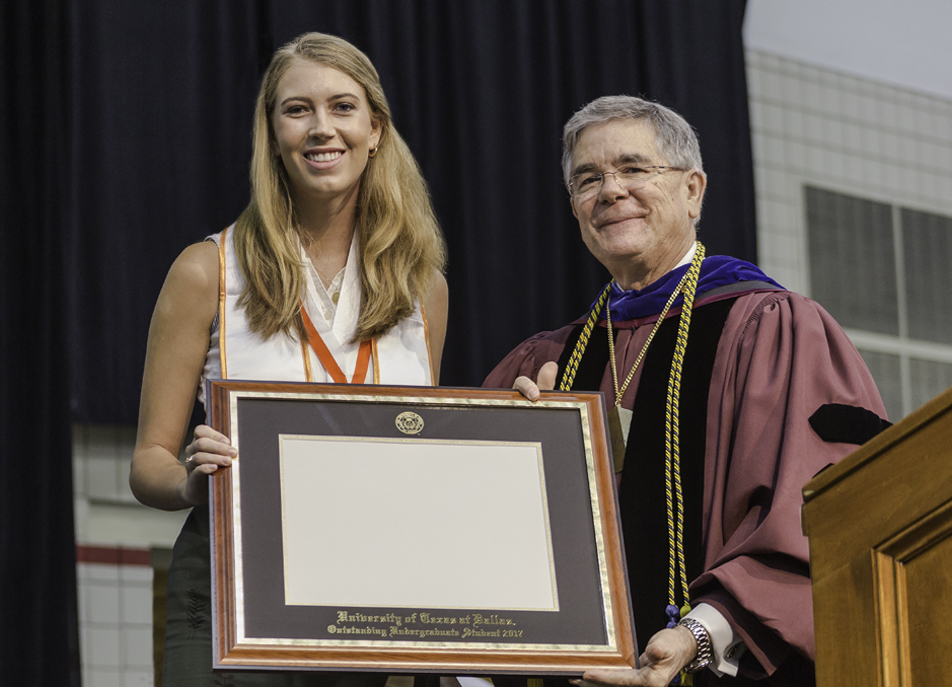 Nancy Fairbank poses with her Outstanding Undergraduate Student Award alongside Dr. Andrew Blanchard, dean of undergraduate education. Fairbank recently became UT Dallas first Marshall Scholarship recipient since 2006.