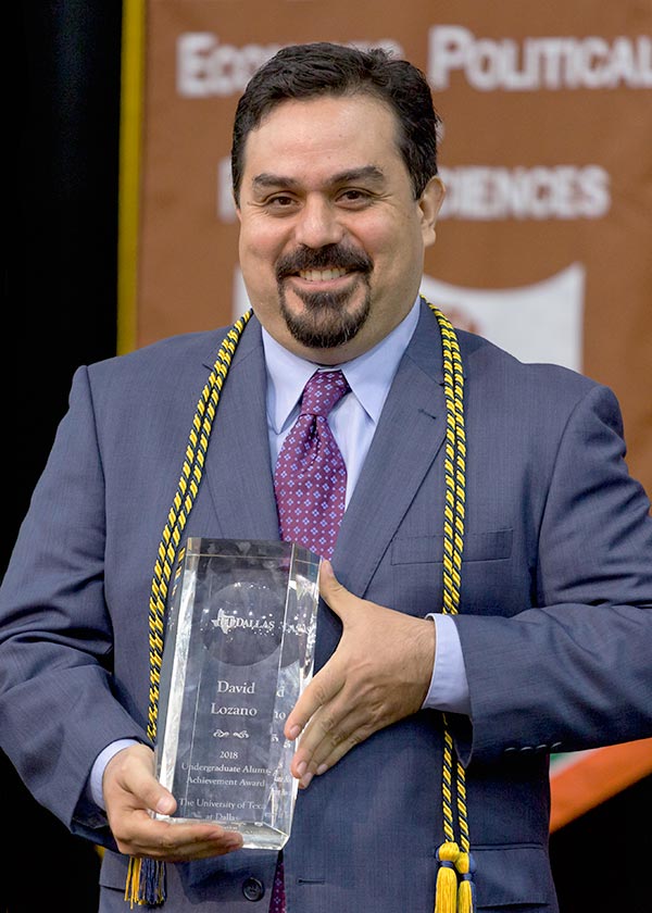 Lozano holding award