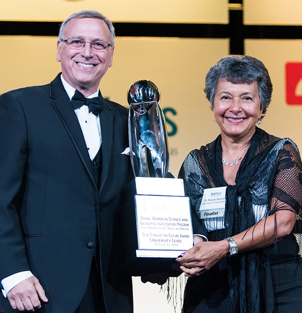 Dr. Magaly Spector (right) receives the Tech Titans of the Future Award-University Level from George Reed, senior vice president of solutions and marketing for Huawei Technologies, the sponsor of the award.
