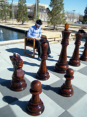 College student playing chess blindfolded
