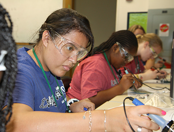 Exodus Campbell participating in UT Dallas' Girl Scout CSI Summer Camp.
