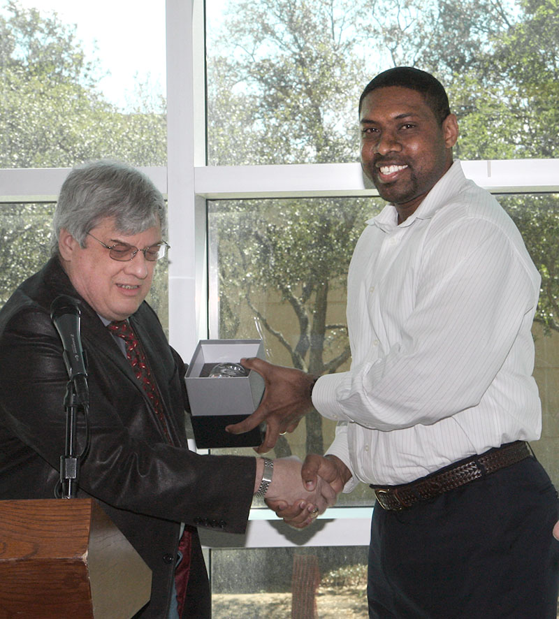 Anthony Cumings receiving teacher award.