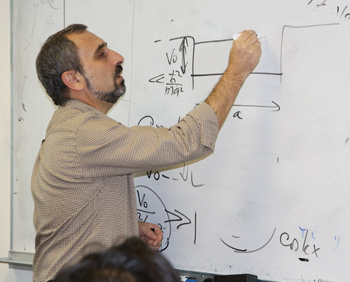 Dr. Yuri Gartstein working on a white board