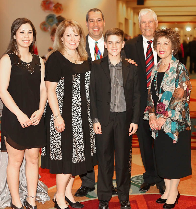 Distinguished Alumni Kevin Ryan marks the occasion with his wife, parents and children. From left: Stephanie, Cristi, Kevin, Jake, Terry and Terry Ryan.