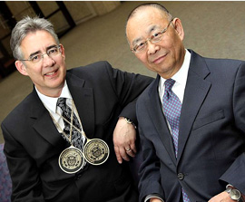 Dean Mark W. Spong, wearing medallions signifying his two separate chairs, praised his mentor, Dr. T.J. Tarn. 