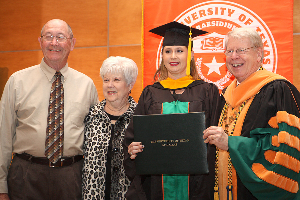 Tracy Blackmon, an accouting masters graduate, pictured with her grandfather James Blackmon and grandmother Donna and Dr. Daniel.