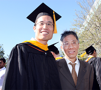 Dustin Tsai with his father at graduation.